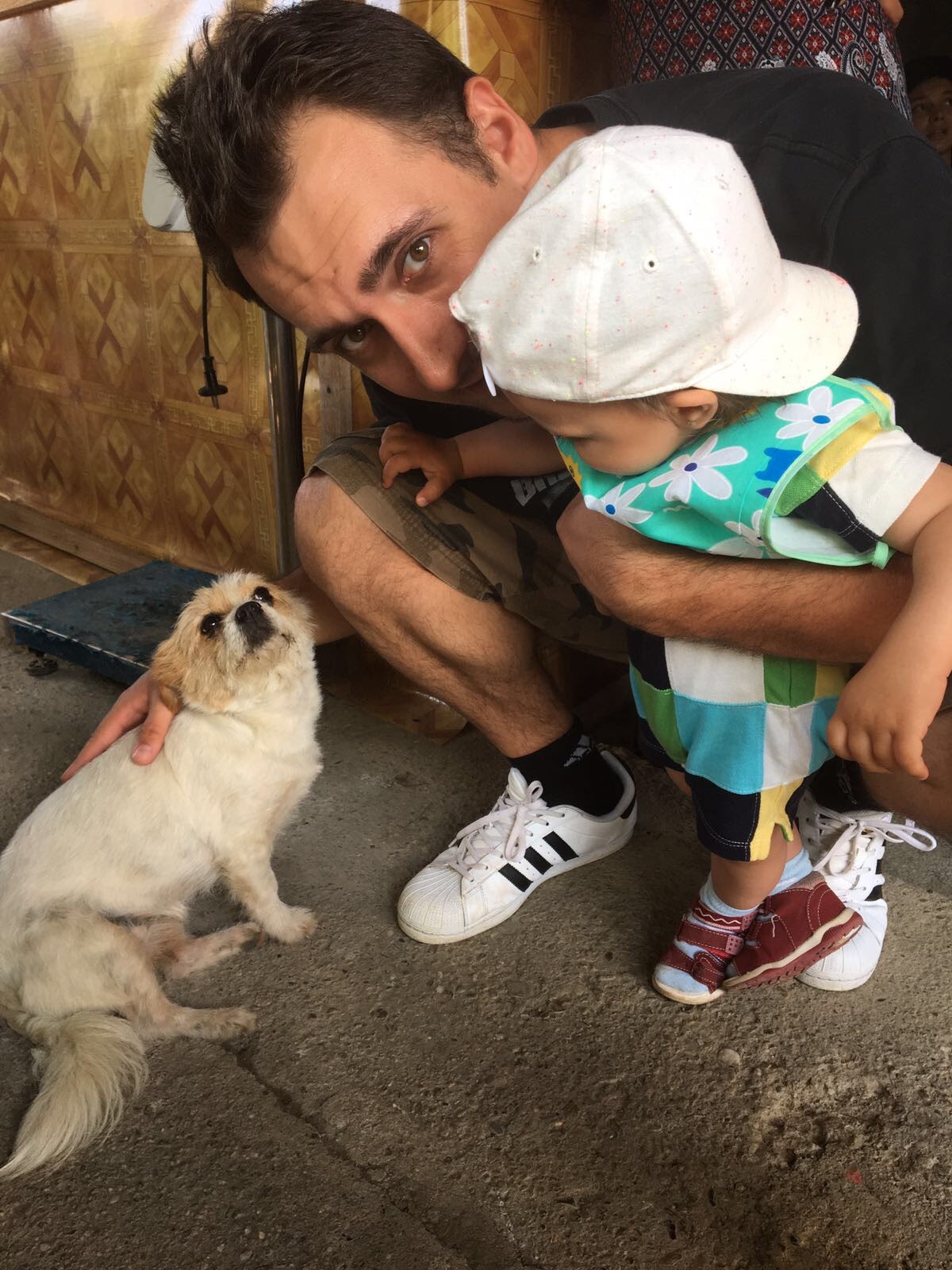 Robert and baby Amy, playing with Milo, one of our late dogs